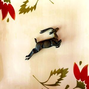 Vintage dark brass leaping gazelle pin